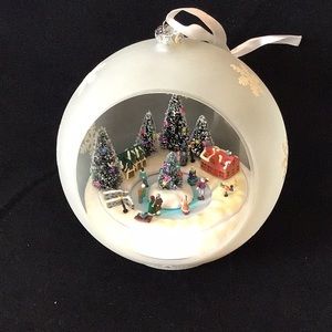 Sorelle Large Christmas ornament plays carols and skaters turn.